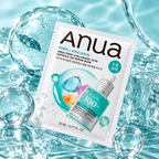 ANUA PDRN Hyaluronic Acid Capsule 100 Serum Mask 23 ml – pakovanje korejske maske okruženo kapljicama vode, staklenim kuglama i tirkiznim odsjajem